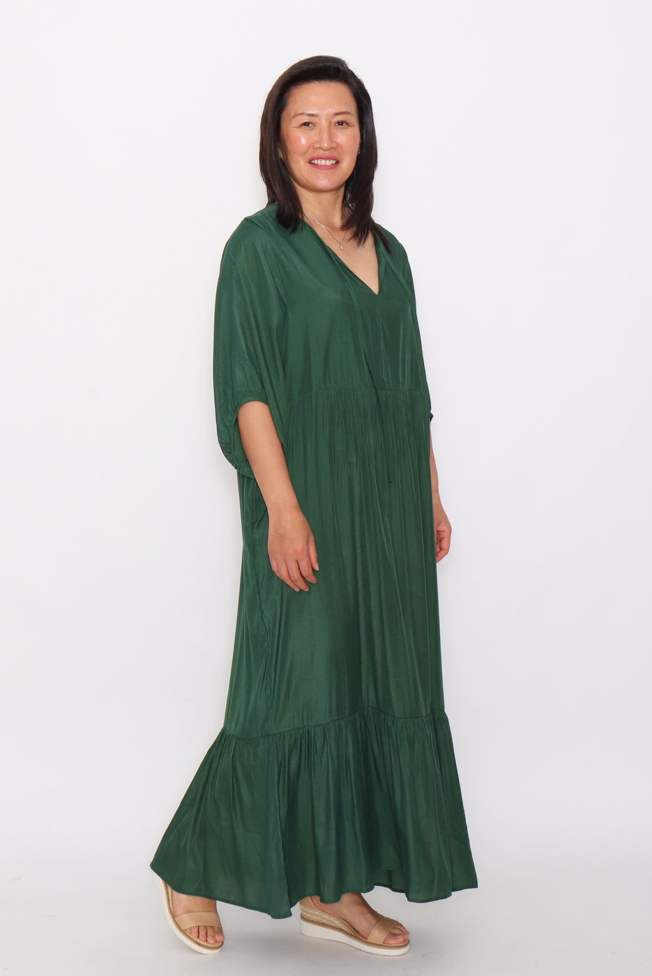 7943 Green Flowy dress with side pockets
